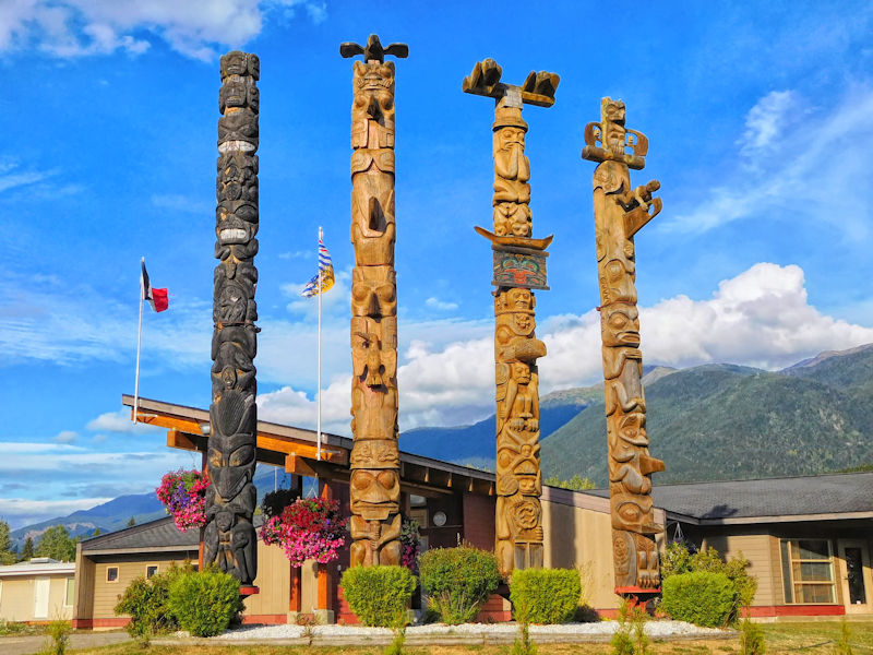 Totem poles in front of the Gitlaxt’aamiks village government office, Nass River valley, BC